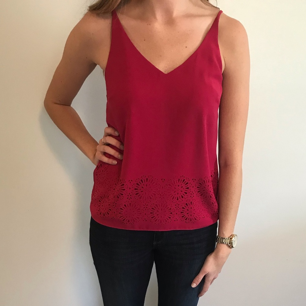 Pink top with floral cutouts. Size small